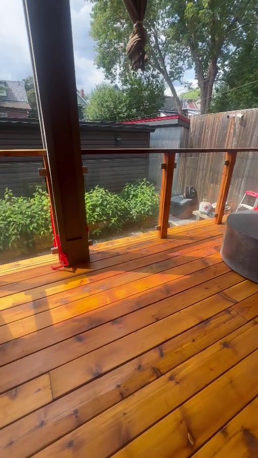 Restored backyard wood deck in warm stain