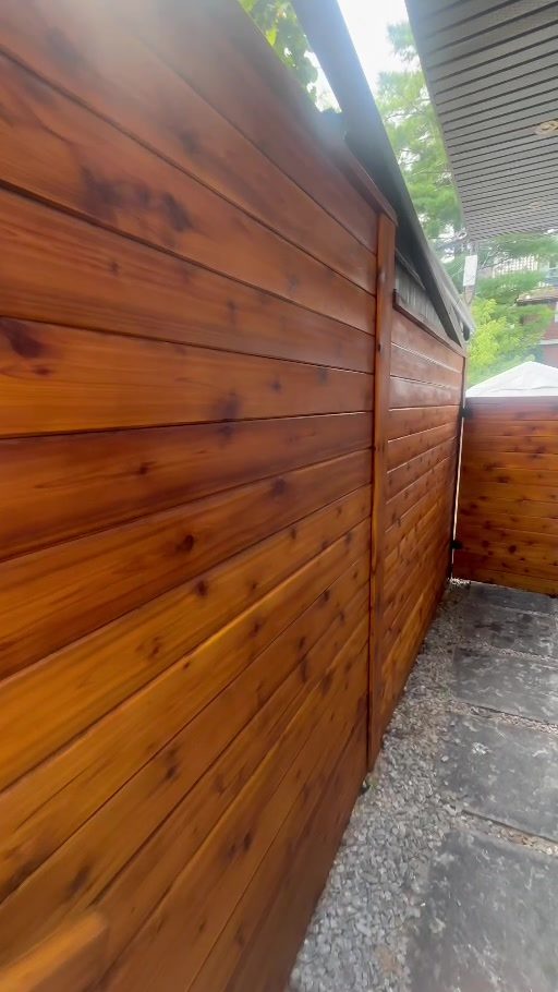 Restored stained wood privacy wall